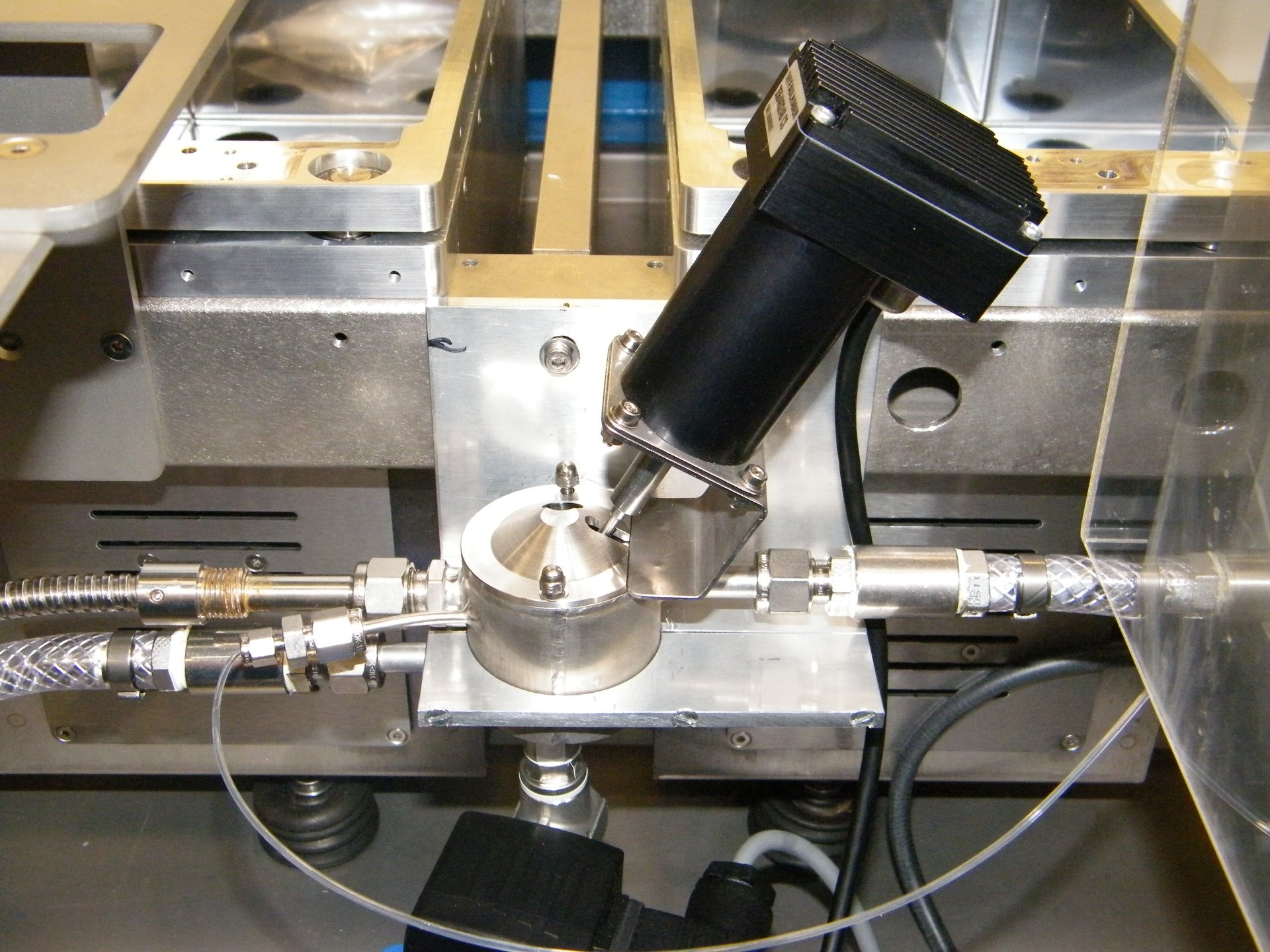 Close-up of a black and steel particle size distribution tool.