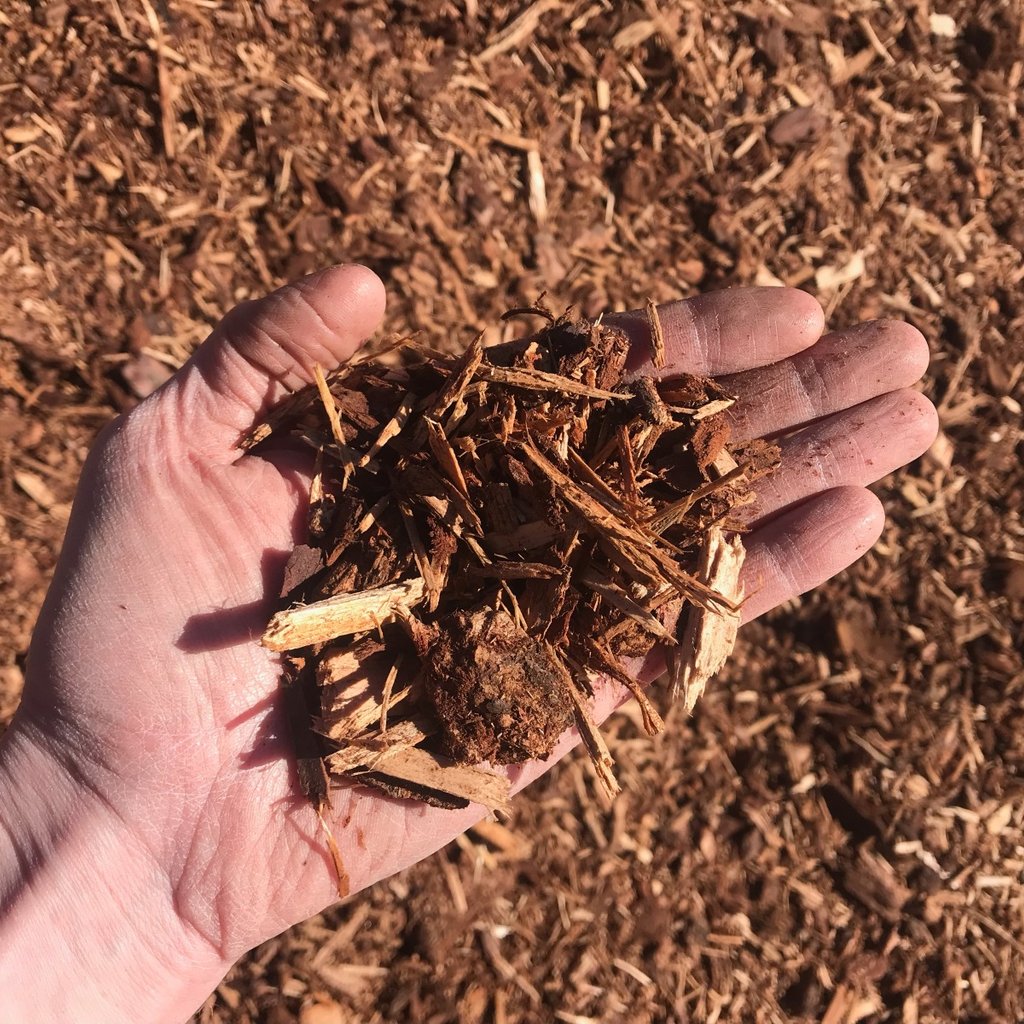 Image of Shredded Fir Bark texture with a hand for scale.