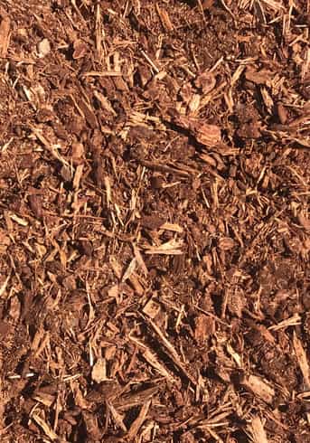 Overhead image that shows the texture of a reddish shredded fir bark mulch product.