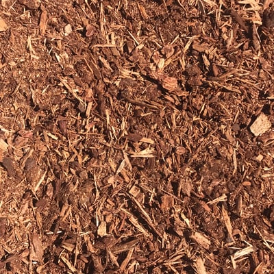 Overhead view of reddish shredded fir bark, a landscape material available for delivery from Little Dumps Missoula.