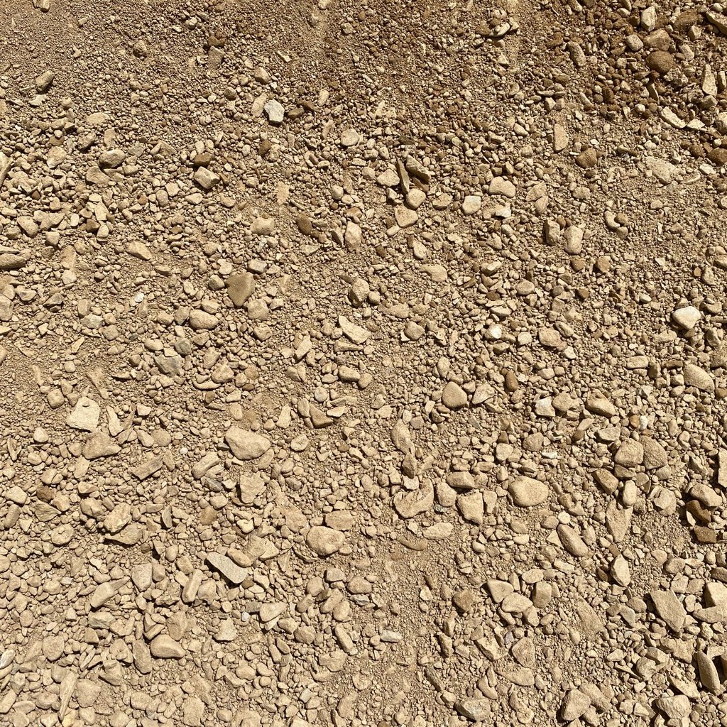 An overhead view of road base compaction gravel on a sunny day.