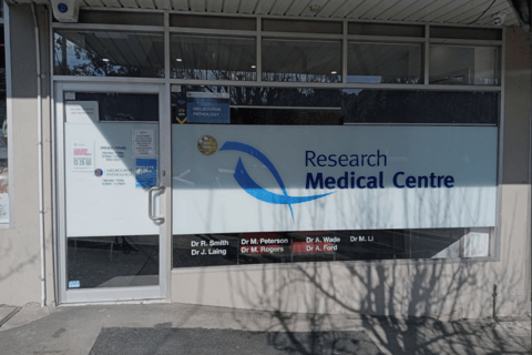Image of Research Medical Centre entrance with the Lifelong symbol in a window.