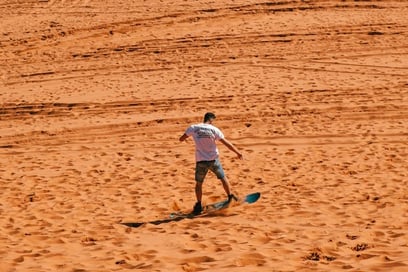 Devour the dunes of Morocco on a sandboard