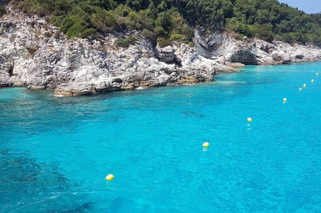 Paxos: walking over the dramatic Tripitos Arch, swimming under the Blue Caves and a boat trip to the seemingly-Caribbean Antipaxos