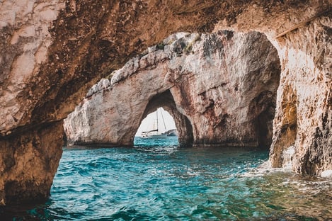 Visit the blue caves by boat (Galazia Spilia)