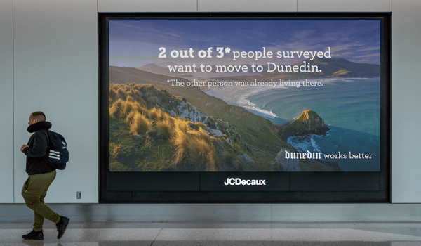If you’re tired of big city life, this billboard says you should move to Dunedin