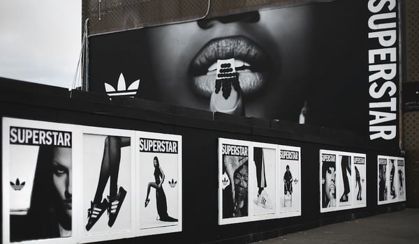 Adidas Superstar sneakers demand attention in Phantom Billstickers’ hand-painted mural