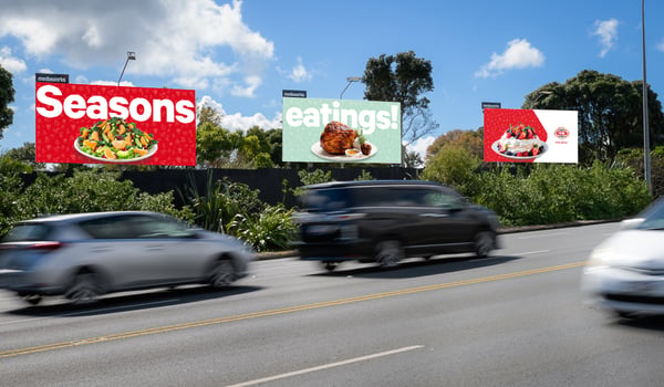 Festive triptych billboard brings “Season’s Greetings” to life for New World