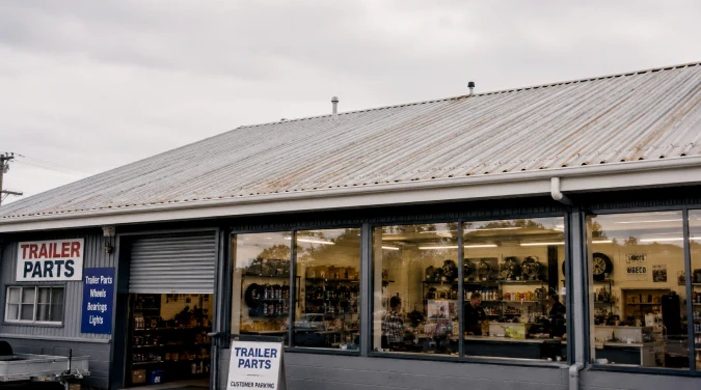 Occupied commercial building beneath an ageing corrugated roof