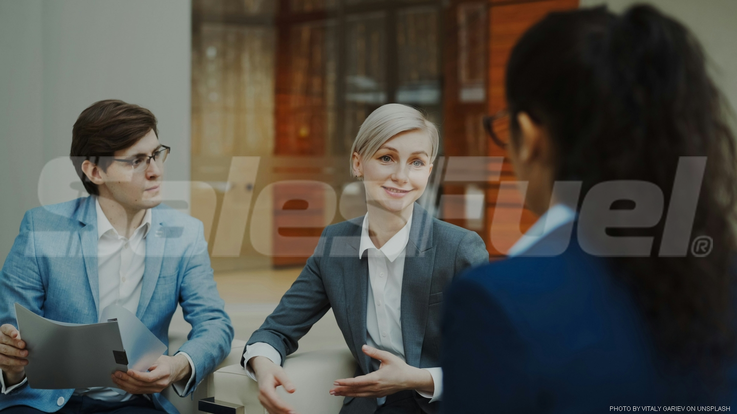 business people seated at table