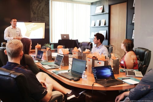 man presenting to group