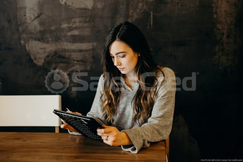 woman looking at computer