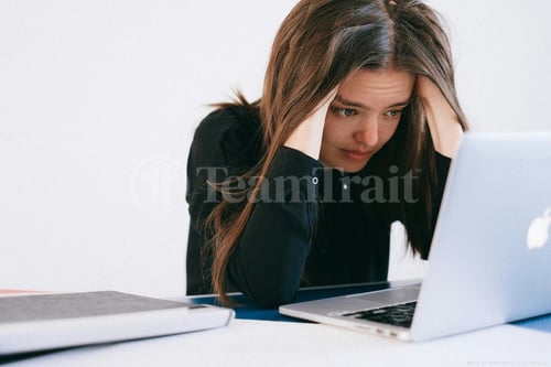 womanholdinghead