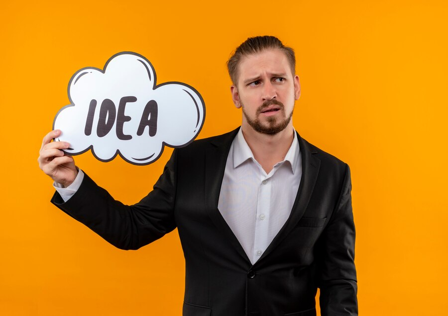 a man having poster with idea word
