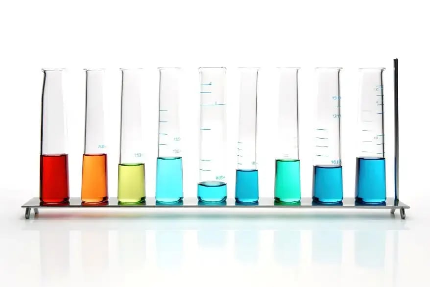 Test tubes having different solutions prepared for spectroscopic analysis.
