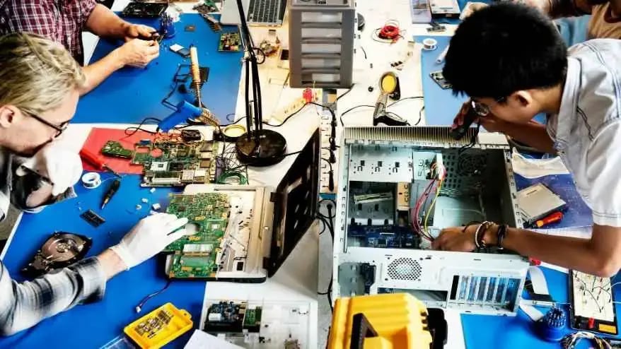 Students working on electronic device