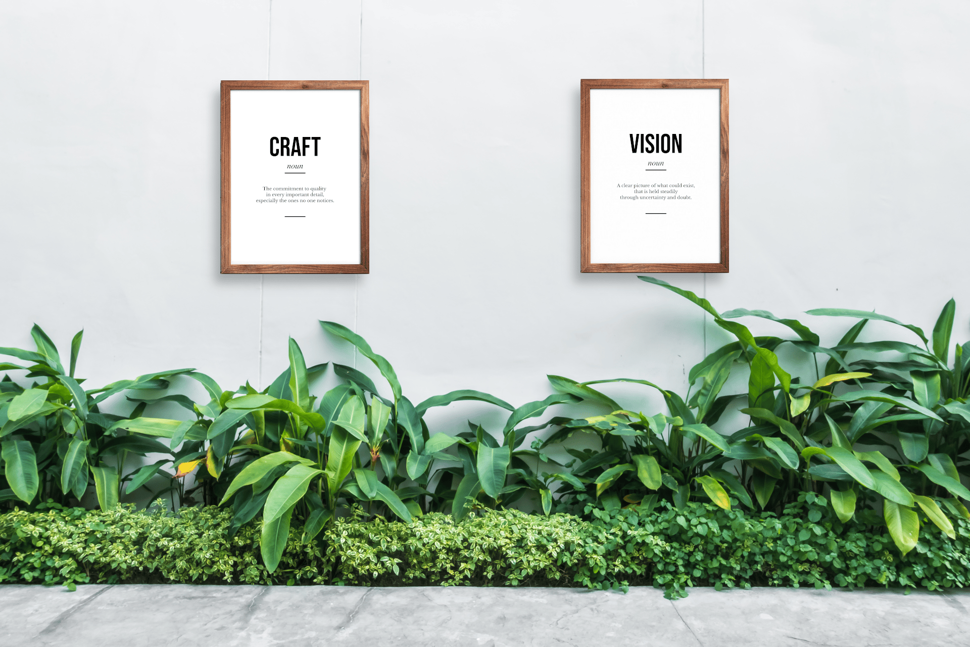 A Motivarr definition poster in a minimal workspace with natural light and a small plant on the desk