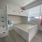 L-shaped double single bunk bed with butterfly cutouts