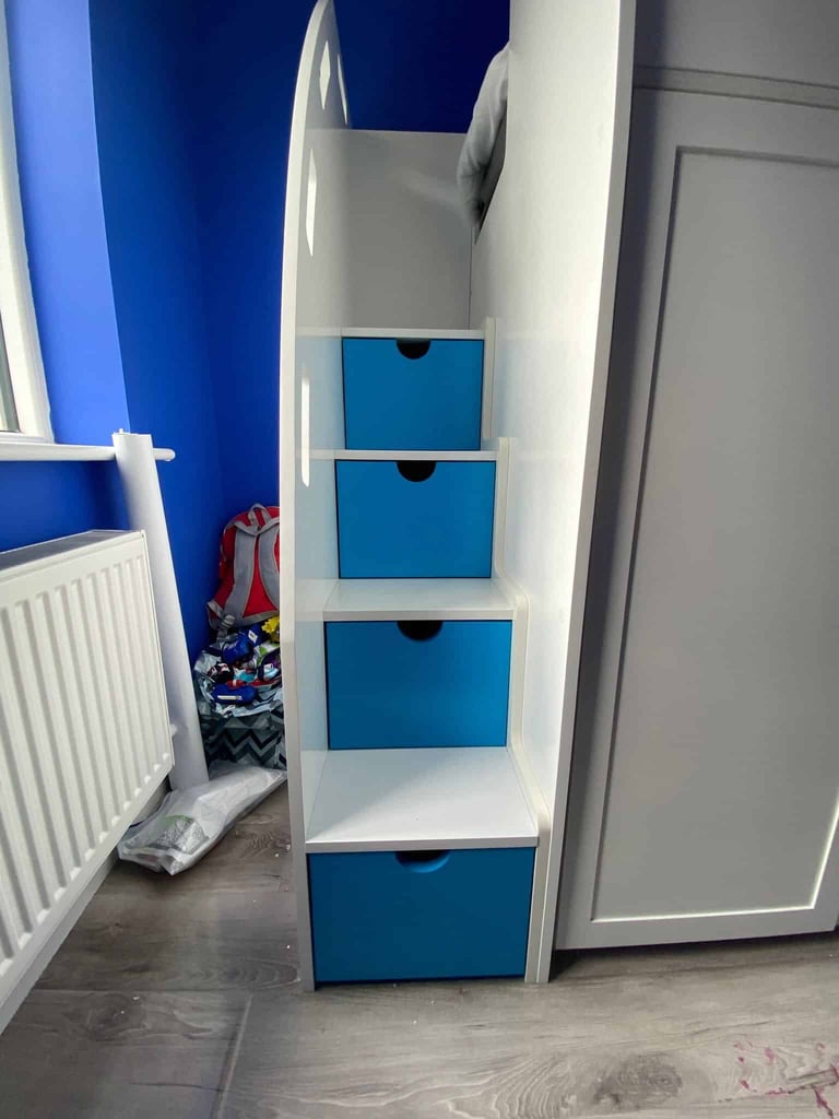 Double bunk beds with stairs and safety rails