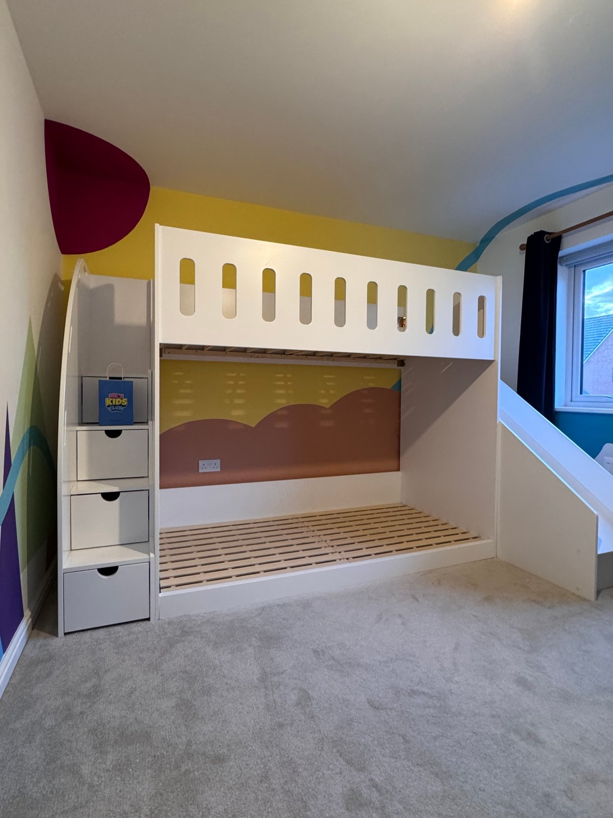 low bunk bed with stairs and slide