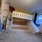 low bunk bed with stairs and slide front view