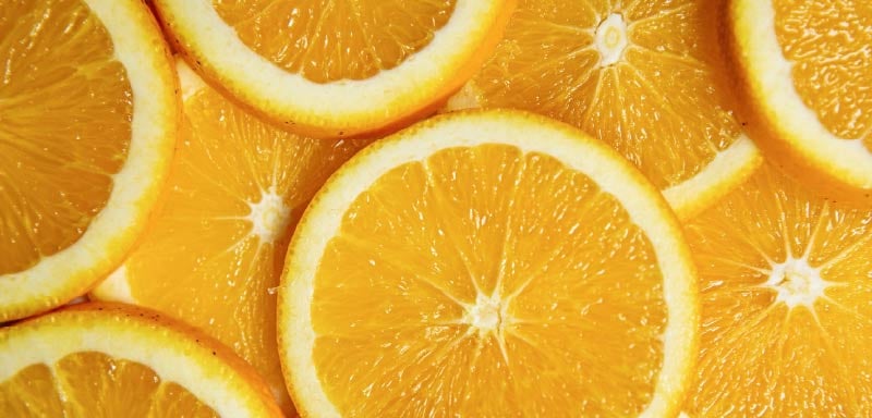 Close-up of sliced oranges showing fresh citrus texture and vibrant color