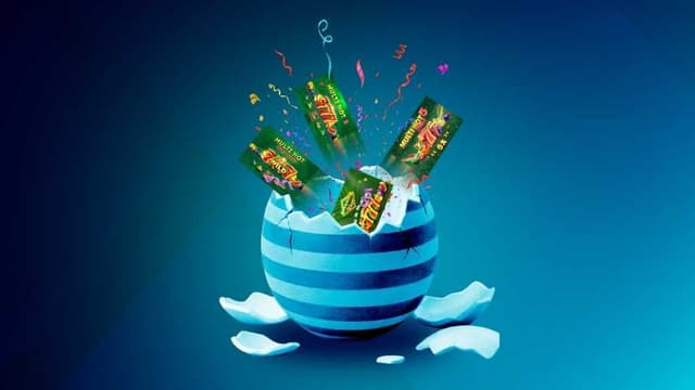 Cracked Easter egg bursting open with Multi Hot Wild 7s casino slot game cards and confetti