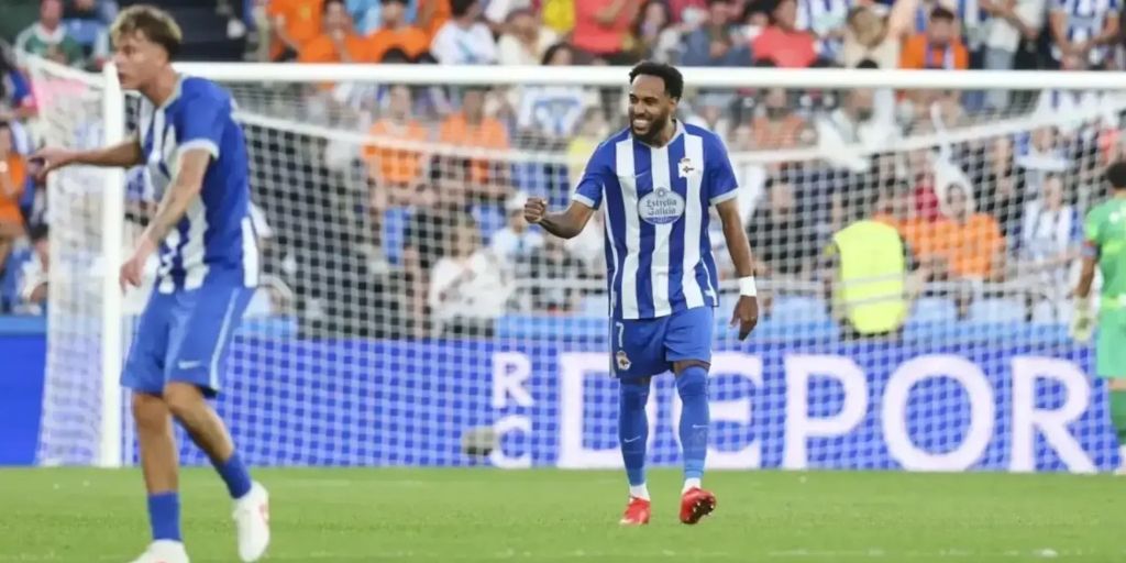 Pierre Emerick Aubameyang celebrating his first competitive goal for Deportivo La Coruna as his teammate celebrates in the foreground while the opposition keeper is partly shown in the background