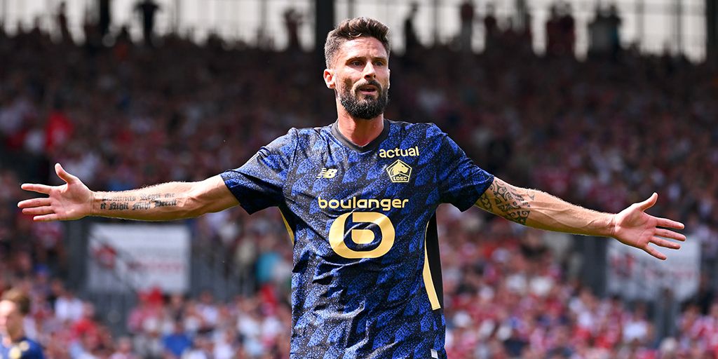 Olivier Giroud in Lille colours with his arms spread wide