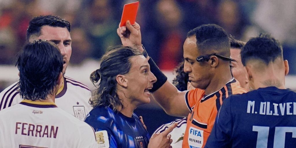 Uruguay winger, Canobbio receiving a red card as his team crashes out of the World Cup to Spain