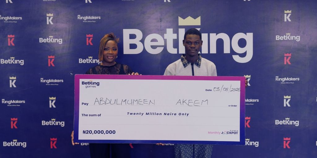 Nengi Akinola; BetKing Nigeria's Head of Marketing and Abdulmumeen Akeen; BetKing's Games Jackpot winner, celebrating with his 20,000,000 prize cheque