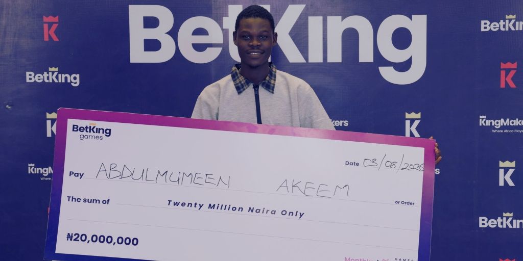 Abdulmumeen Akeem; BetKing's Games Jackpot winner, celebrating with his 20,000,000 prize cheque