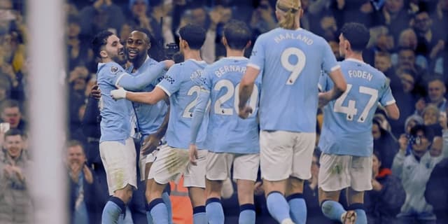 Haaland celebrating along with other Man City players