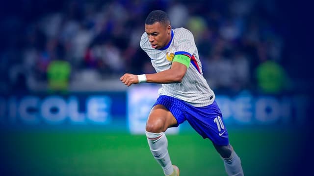 Kylian Mbappe advancing the ball upfield