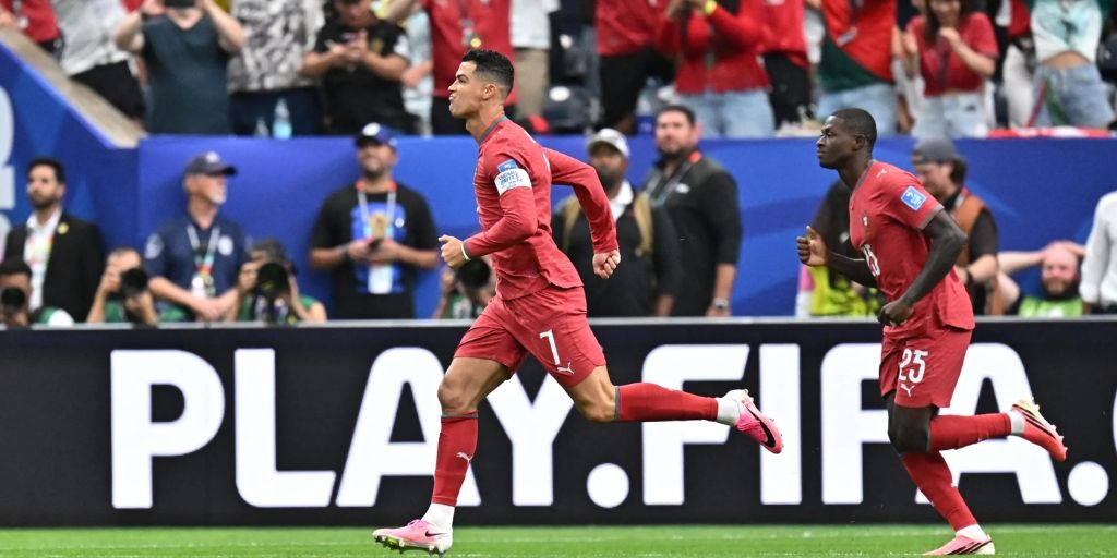 Ronaldo and Mendes celebrate Ronaldo's World Cup goal