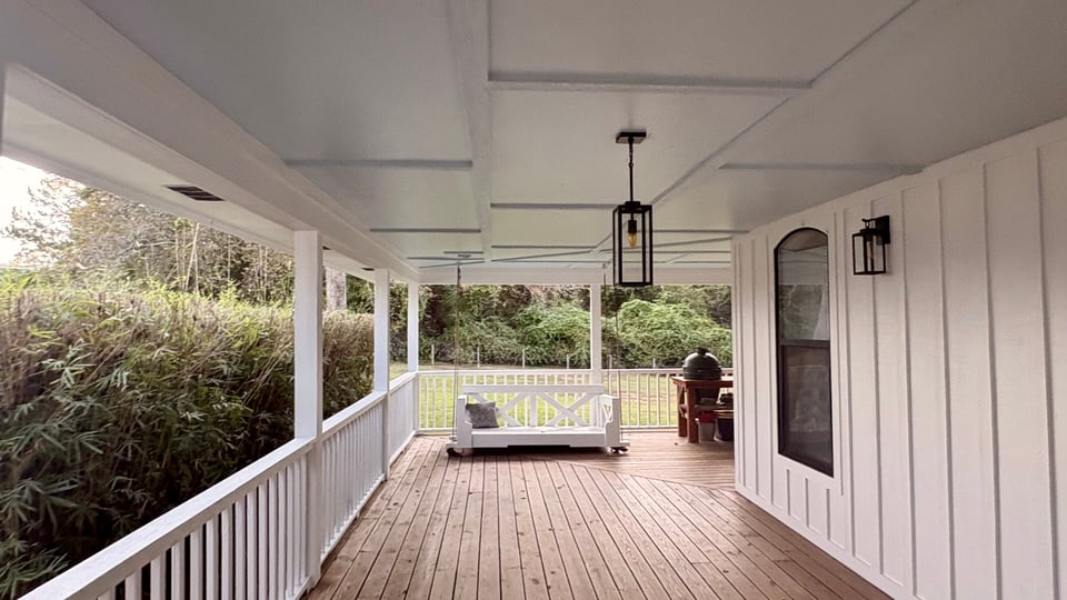 Dependable Painting crew applying finish coat to interior wall in Baldwin County home