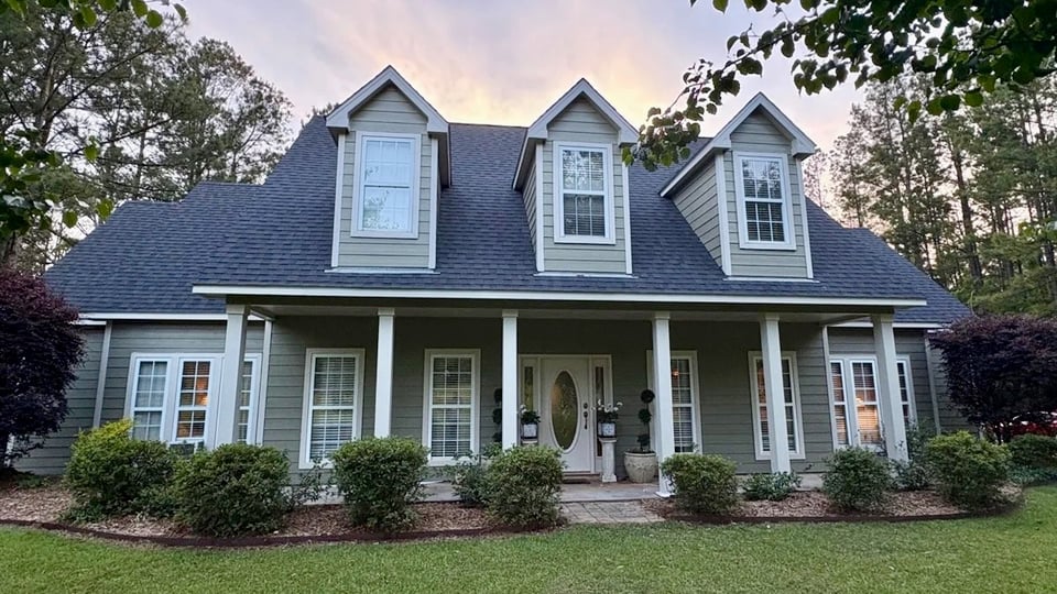 Exterior house painting project with weather-resistant coating