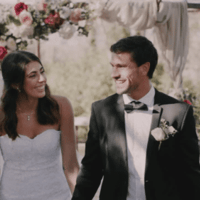 Smiling couple at wedding, ideal for a guest book with QR code to collect wedding photos.