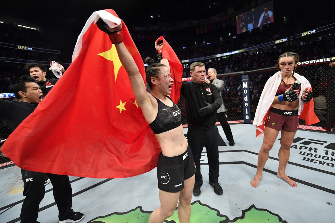Zhang Weili raises the Five-Star Red Flag in the Octagon. Image courtesy of UFC