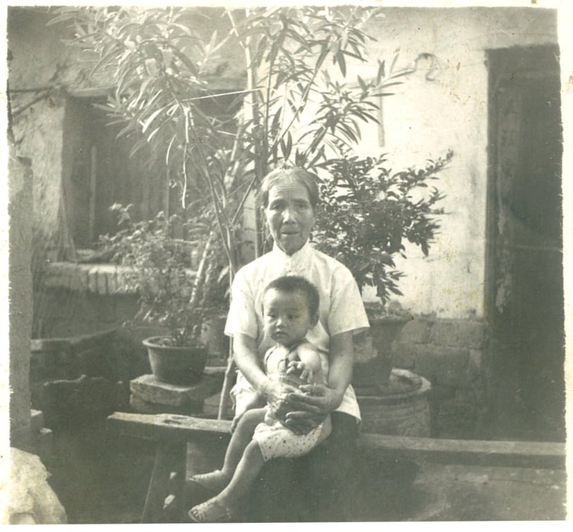 Shen Yang at two years old with her grandmother