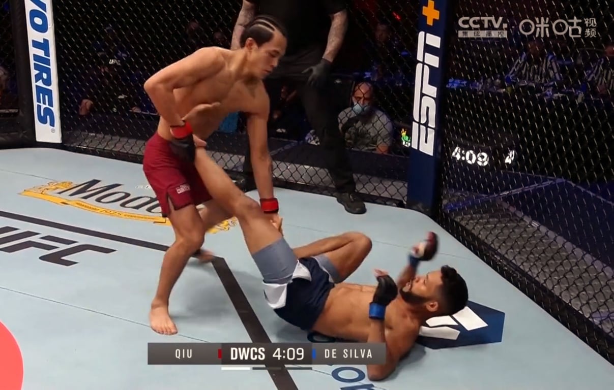 Qiulun grabs Silva’s leg during their bout during the final episode of Dana White’s Contender Series Season 5