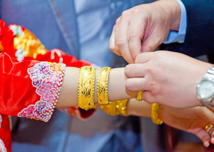a chinese bride receiving a bride gift of jewelry