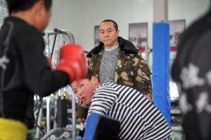 En Bo with some young martial arts practitioners in Chengdu in January of 2015. Image via VCG