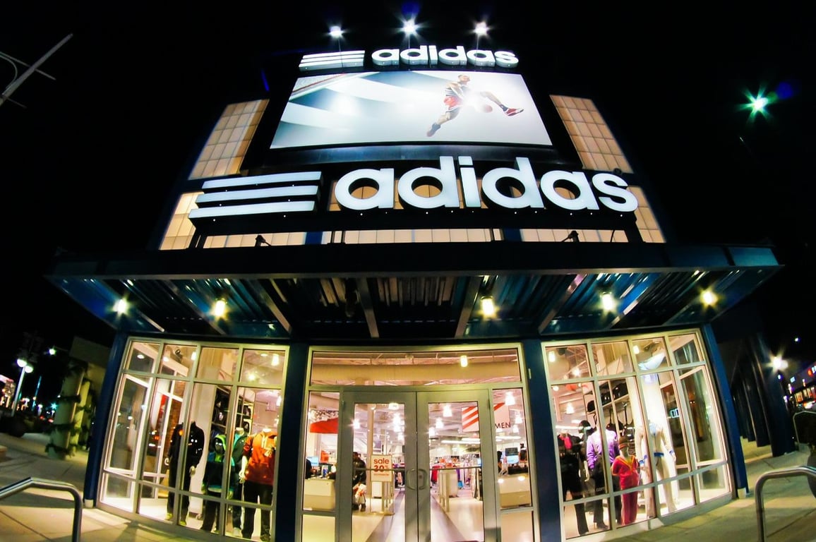 adidas storefront at nighttime