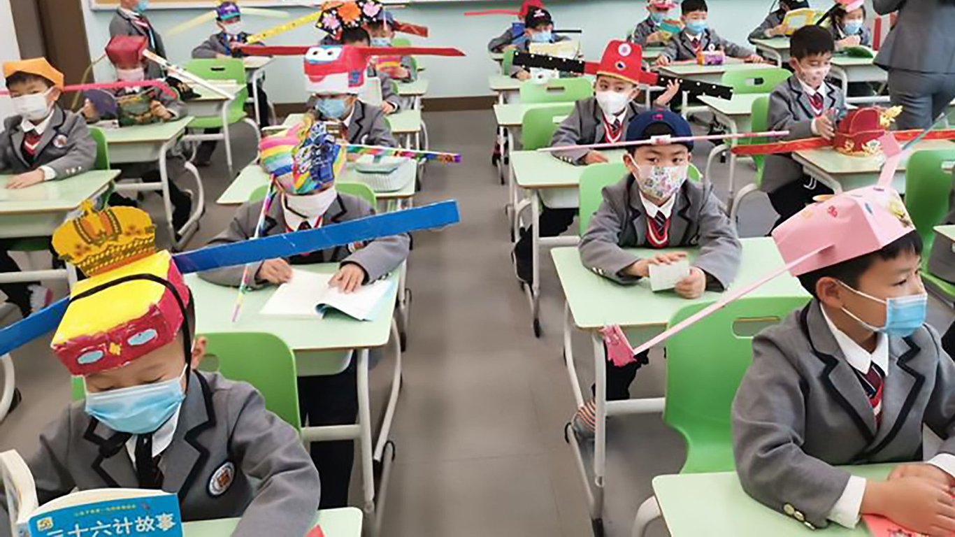 social-distancing-hats-first-graders
