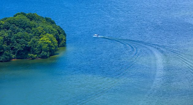 A boat cruising on Fairy Lake