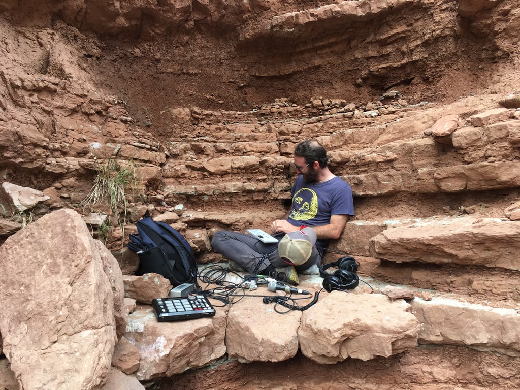 Jeremy with a portable studio setup in a grotto in Keba, Qinghai.