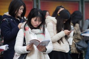 Chinese examinees review textbooks