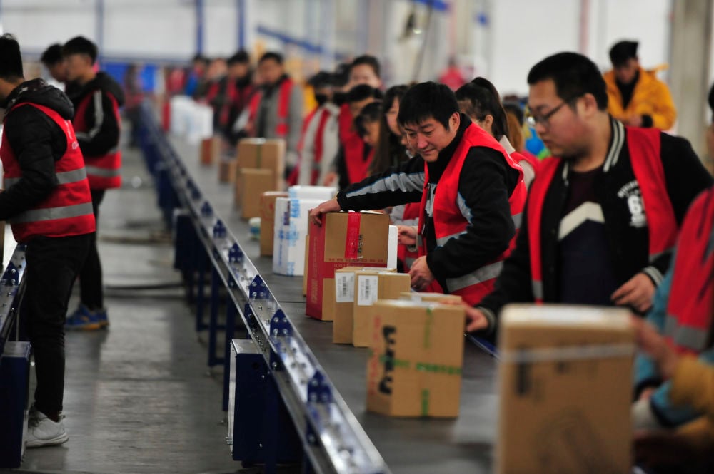 Chinese workers in a factory, global happiness study 2023, ipsos global happiness survey, ipsos survey