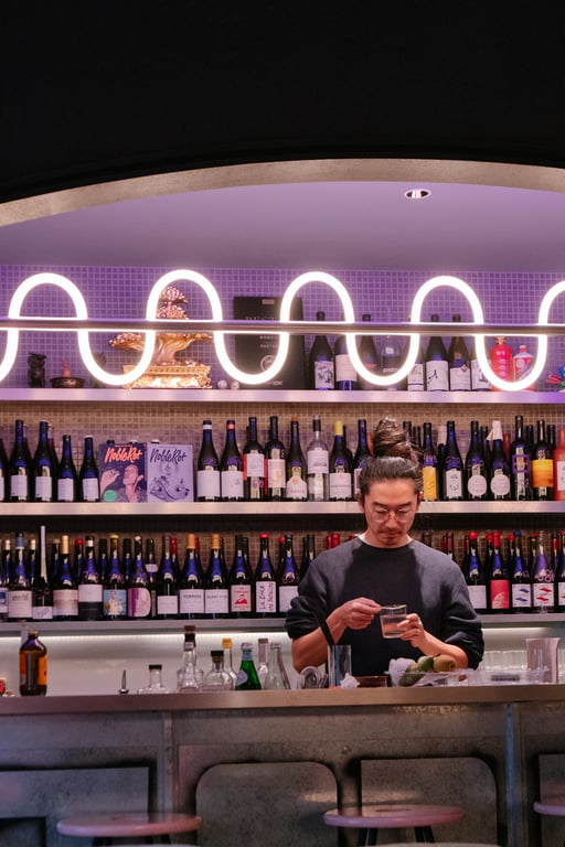 Dongwei Su behind the bar